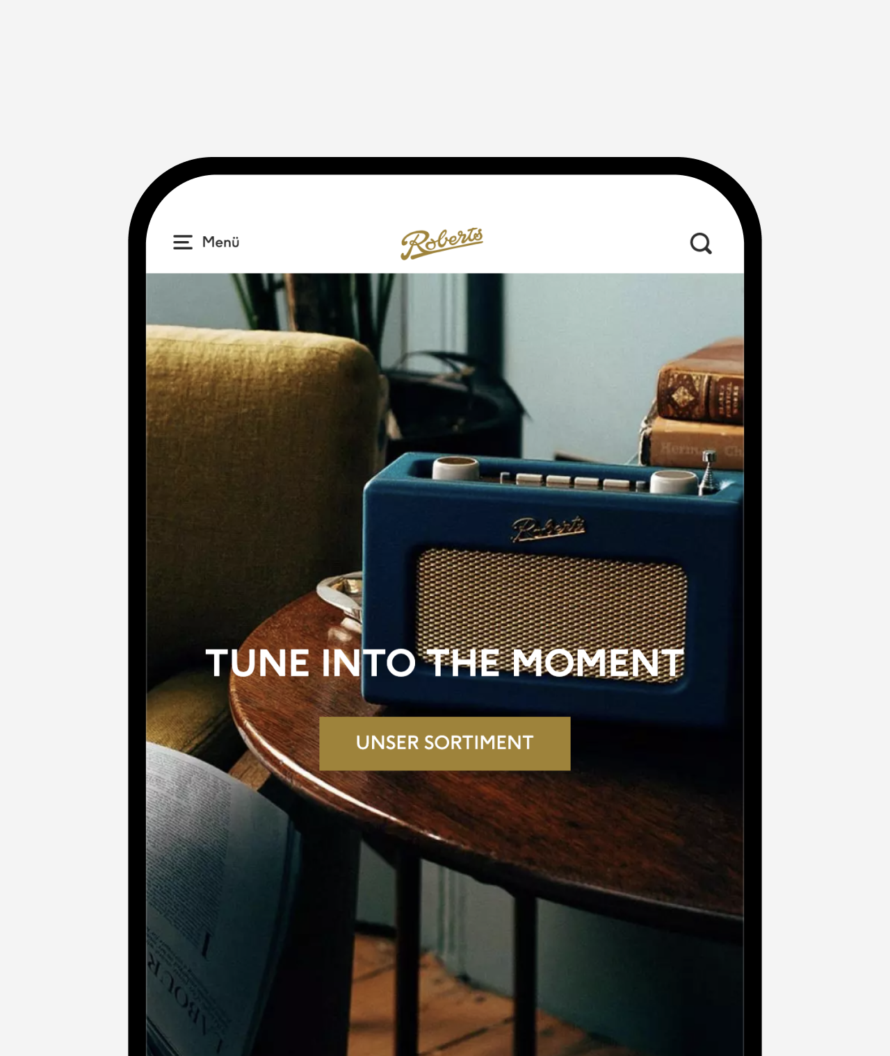 phone showing the Roberts website "tune into the moment"