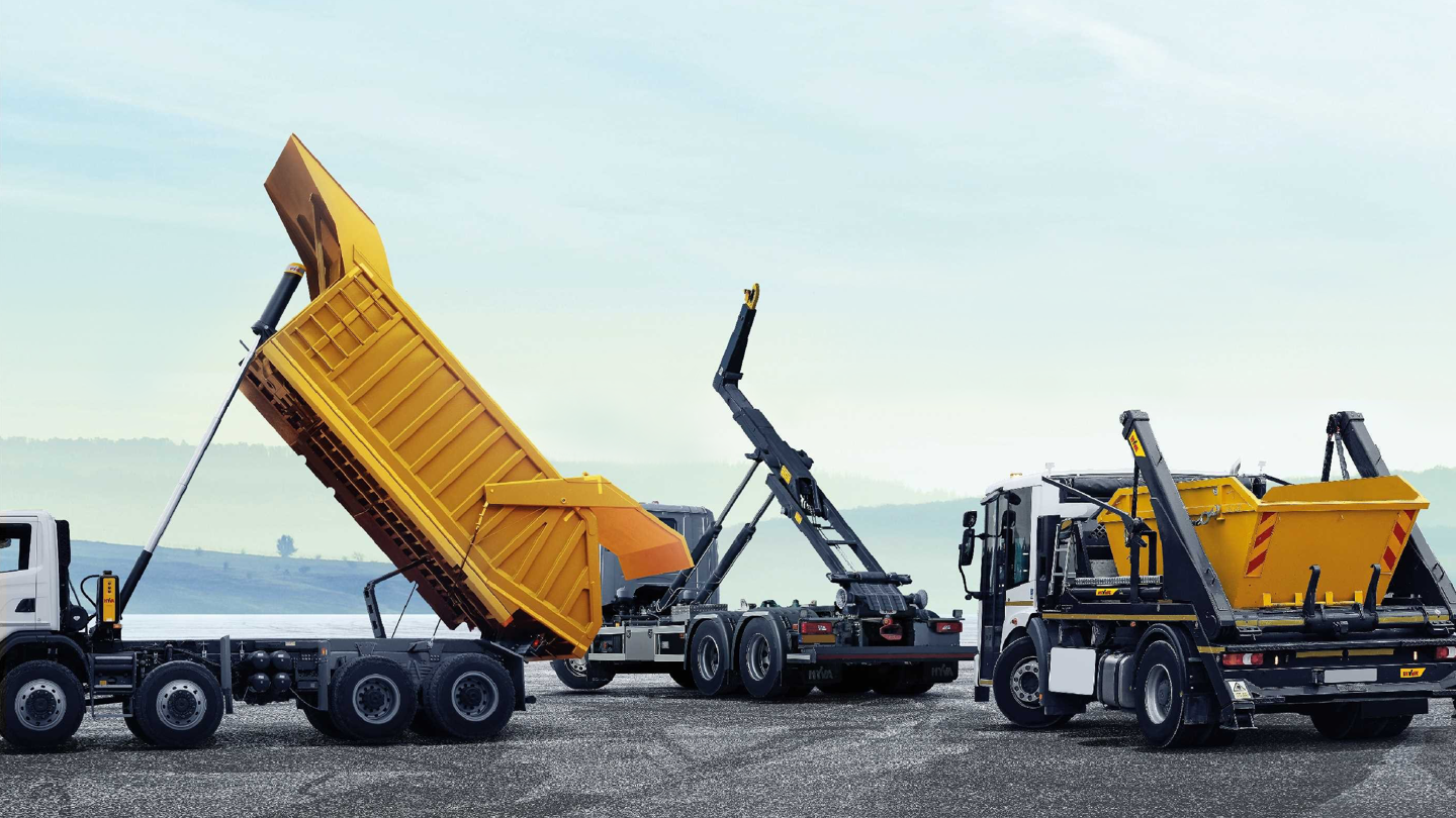Construction trucks unloading cargo