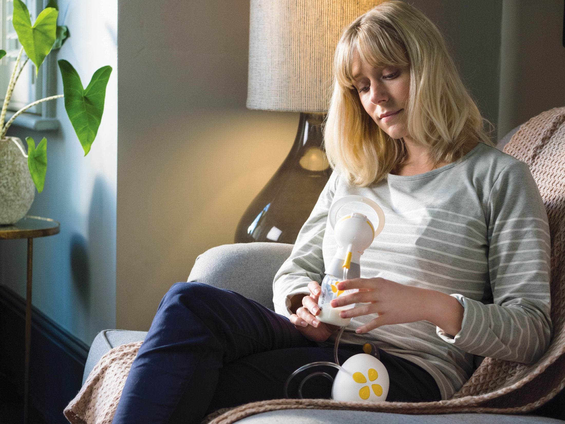 Mother using Medela product