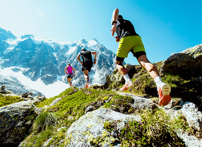 people running up mountain