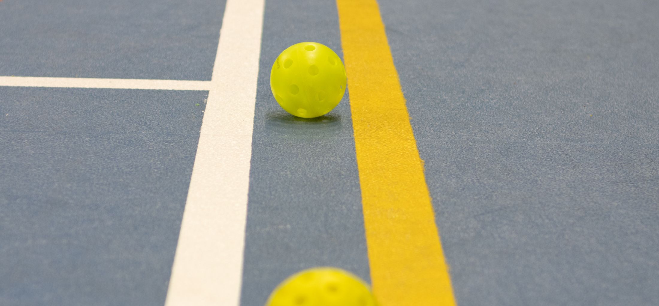 pickleball balls on court
