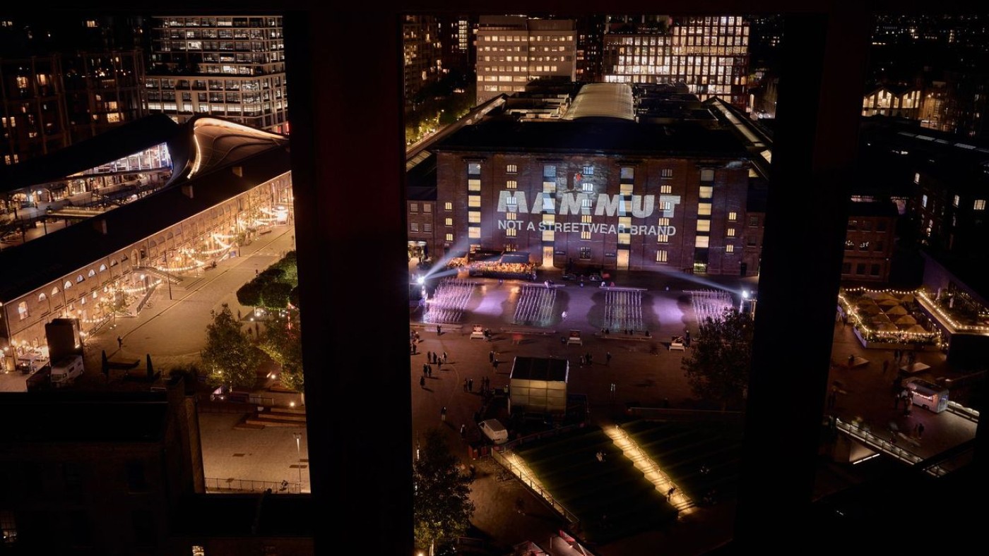 Birds eye view shot of the Mammut logo projected onto a building