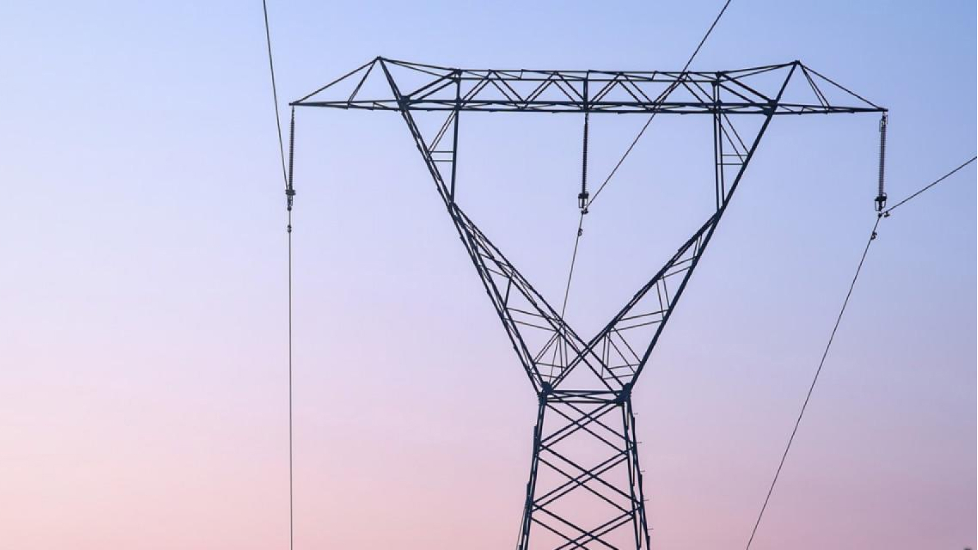 Dusky sky with electricity poles in forground