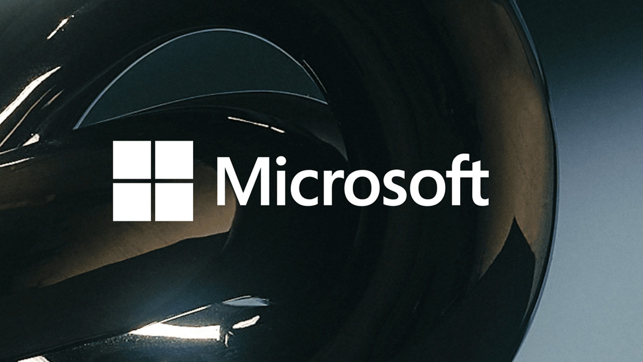 White Microsoft logo on a black background.