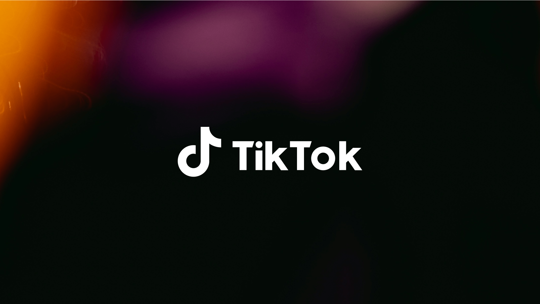 White TikTok logo on black background with orange and purple shade.